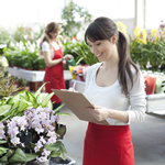 Two employees taking stock at a flower shop.